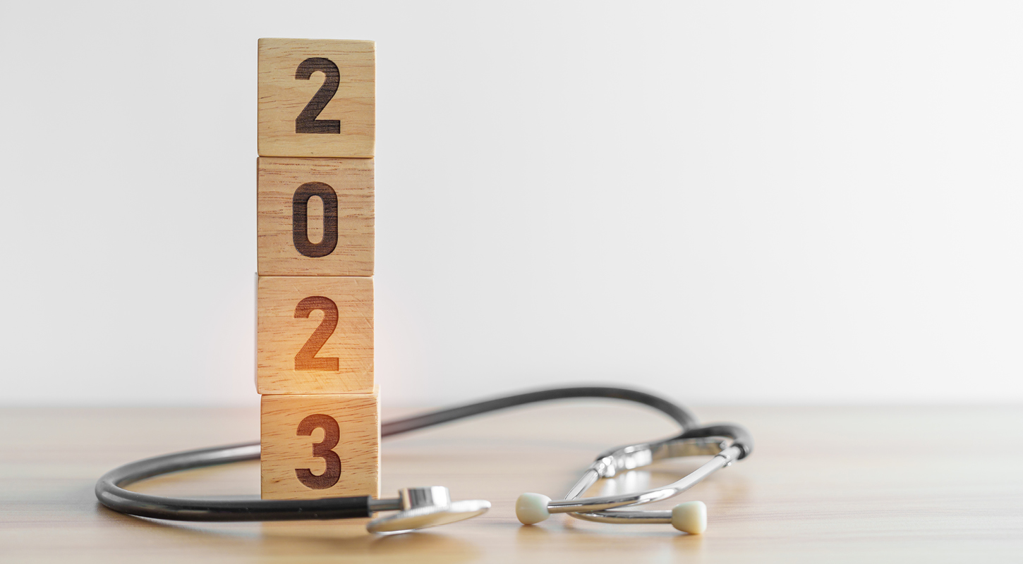 2023 printed on wooden blocks next to stethoscope