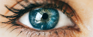 Close-up of woman's bright blue eye